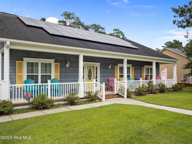 211 Brook Crossing Rd, Swansboro, NC 28584 - view of front of property featuring a shingled roof, a porch, roof mounted solar panels, and a front yard