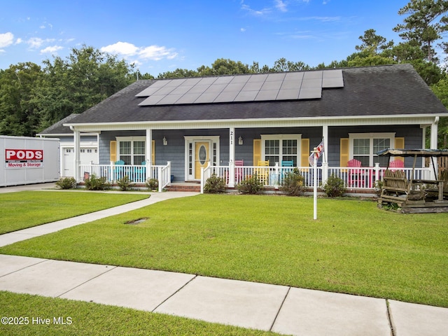 211 Brook Crossing Rd, Swansboro, NC 28584 - view of front of home with covered porch, roof with shingles, roof mounted solar panels, and a front yard