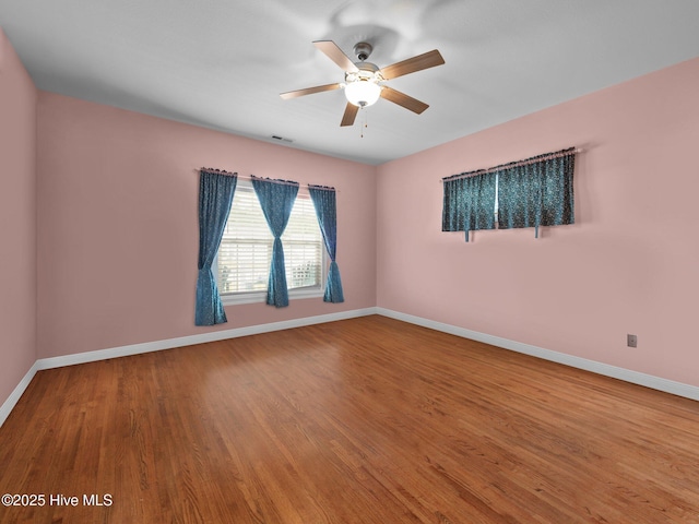 211 Brook Crossing Rd, Swansboro, NC 28584 - unfurnished room with a ceiling fan and wood finished floors