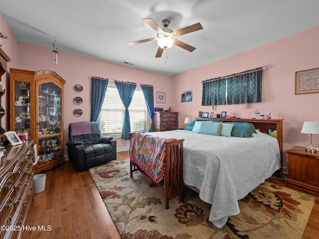 211 Brook Crossing Rd, Swansboro, NC 28584 - bedroom featuring wood finished floors and a ceiling fan