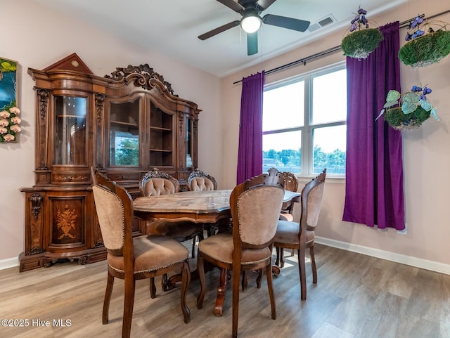 227 Cheswick Dr, Holly Ridge, NC 28445 - dining area with light wood-style floors, baseboards, and a ceiling fan