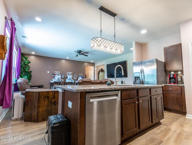 227 Cheswick Dr, Holly Ridge, NC 28445 - kitchen featuring appliances with stainless steel finishes, open floor plan, light wood-type flooring, ceiling fan, and recessed lighting