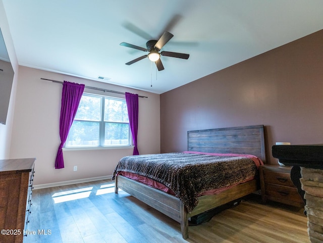 227 Cheswick Dr, Holly Ridge, NC 28445 - bedroom with wood finished floors, baseboards, and ceiling fan
