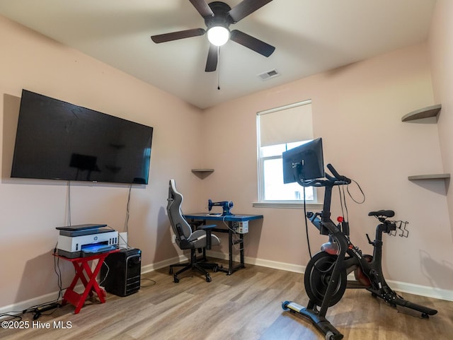 227 Cheswick Dr, Holly Ridge, NC 28445 - workout area with wood finished floors, ceiling fan, and baseboards