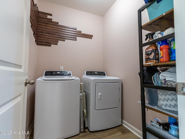 227 Cheswick Dr, Holly Ridge, NC 28445 - laundry room with washer and clothes dryer, wood finished floors, and baseboards