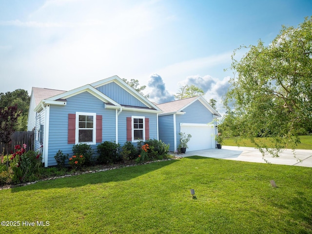 227 Cheswick Dr, Holly Ridge, NC 28445 - view of front of home with concrete driveway, an attached garage, and board and batten siding
