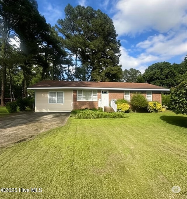 5017 Curve Rd, Elm City, NC 27822 - ranch-style house featuring a front yard and brick siding