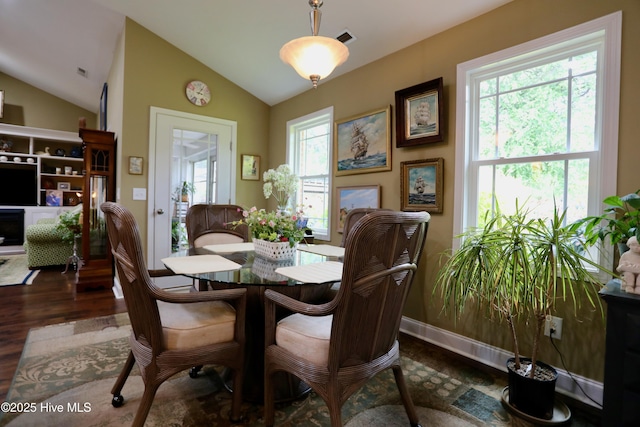 275 Pinehurst Trace Dr, Pinehurst, NC 28374 - dining area featuring vaulted ceiling, healthy amount of natural light, and dark wood-style floors