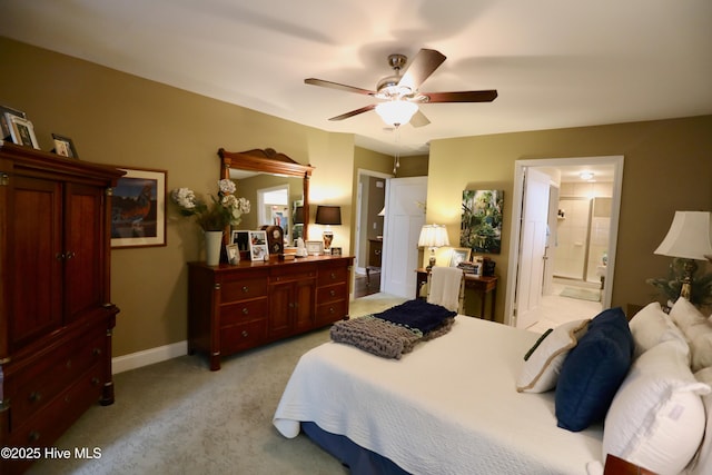 275 Pinehurst Trace Dr, Pinehurst, NC 28374 - bedroom with light colored carpet, connected bathroom, baseboards, and ceiling fan
