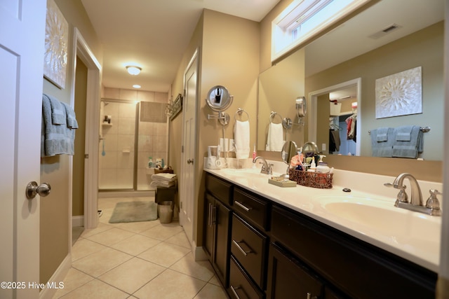 275 Pinehurst Trace Dr, Pinehurst, NC 28374 - full bath with tile patterned floors, a shower stall, double vanity, baseboards, and a walk in closet
