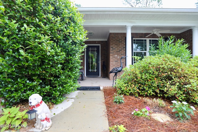 275 Pinehurst Trace Dr, Pinehurst, NC 28374 - view of exterior entry with brick siding, ceiling fan, and a porch