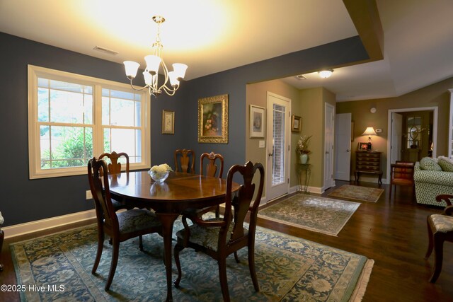 275 Pinehurst Trace Dr, Pinehurst, NC 28374 - dining room with a chandelier, wood finished floors, and baseboards