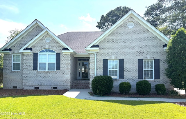 3101 Redfield Dr, Leland, NC 28451 - view of front of property featuring crawl space, a front lawn, brick siding, and a shingled roof