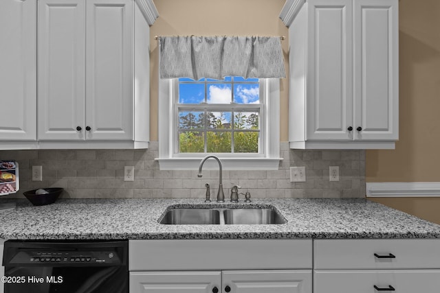 3101 Redfield Dr, Leland, NC 28451 - kitchen with a sink, dishwasher, white cabinets, decorative backsplash, and light stone counters