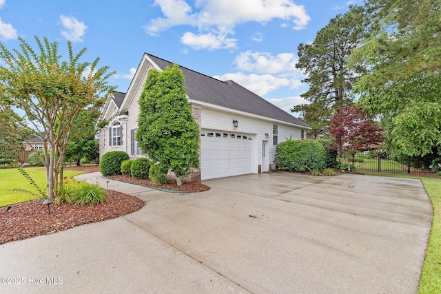 3101 Redfield Dr, Leland, NC 28451 - view of side of property with concrete driveway and an attached garage
