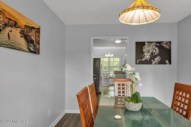105 Sea Turtle Cv, Sneads Ferry, NC 28460 - dining room with a chandelier, baseboards, and wood finished floors