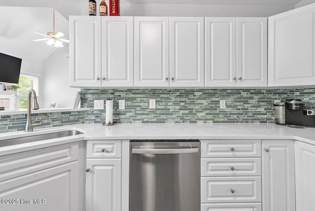 105 Sea Turtle Cv, Sneads Ferry, NC 28460 - kitchen featuring dishwasher, a sink, white cabinets, light countertops, and vaulted ceiling