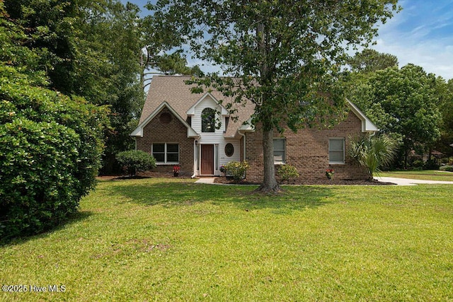 105 Sea Turtle Cv, Sneads Ferry, NC 28460 - traditional-style home with a front lawn and brick siding