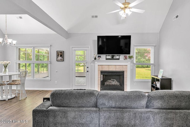 105 Sea Turtle Cv, Sneads Ferry, NC 28460 - living room featuring wood finished floors, a chandelier, ceiling fan, plenty of natural light, and high vaulted ceiling