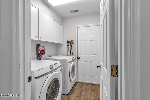 105 Sea Turtle Cv, Sneads Ferry, NC 28460 - washroom with cabinet space, separate washer and dryer, and dark wood-style floors