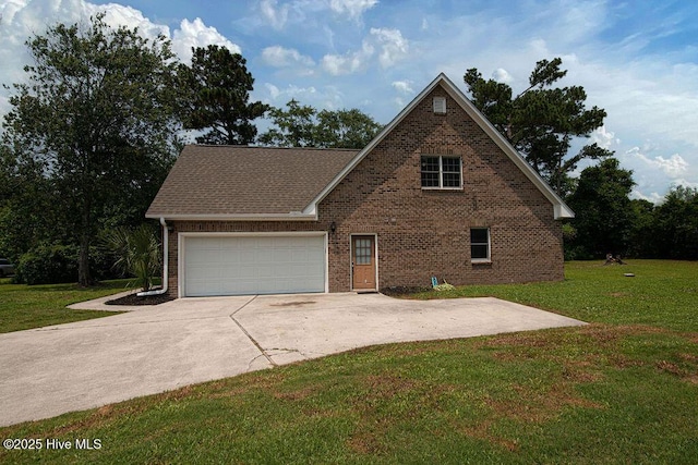 105 Sea Turtle Cv, Sneads Ferry, NC 28460 - view of front of house featuring brick siding, a garage, a front lawn, and driveway