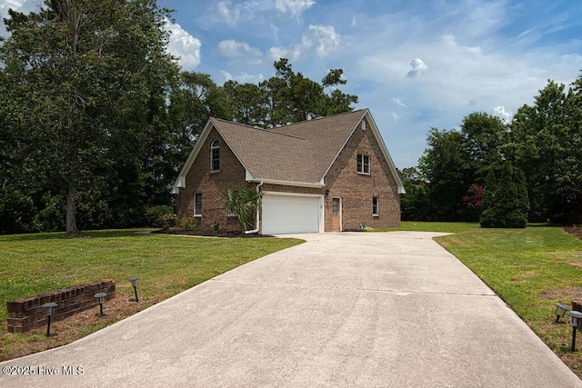 105 Sea Turtle Cv, Sneads Ferry, NC 28460 - view of front of house featuring concrete driveway, brick siding, a front yard, and a shingled roof