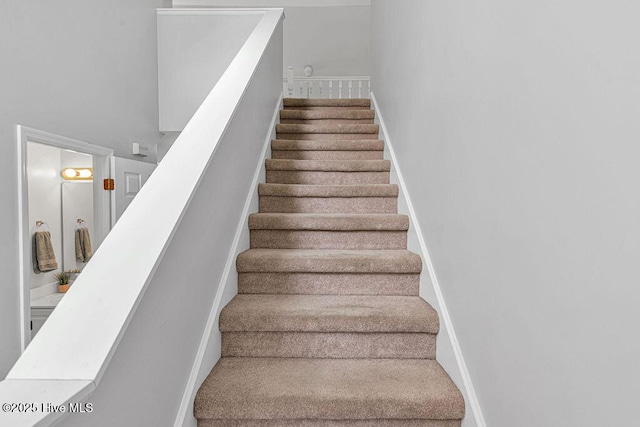 105 Sea Turtle Cv, Sneads Ferry, NC 28460 - stairs with baseboards and carpet
