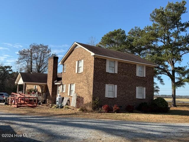 1164 Ocean Hwy N, Hertford, NC 27944 - view of side of property with a chimney and brick siding