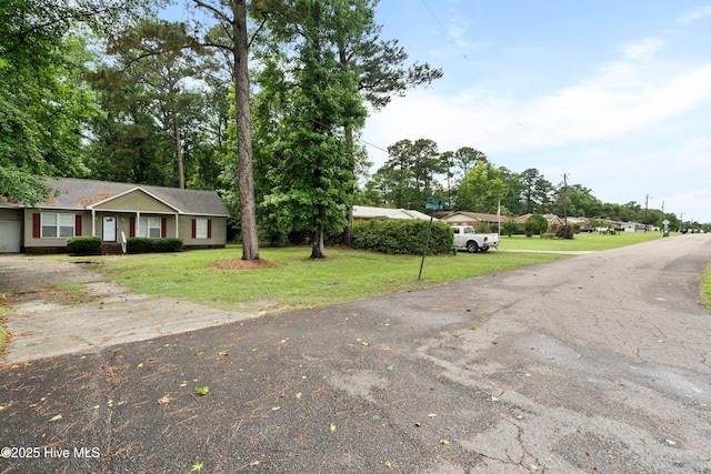 330 Brookfield Dr, Wilmington, NC 28405 - view of front facade with driveway, a front yard, and an attached garage