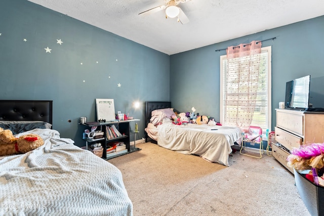 330 Brookfield Dr, Wilmington, NC 28405 - carpeted bedroom featuring a ceiling fan, vaulted ceiling, and a textured ceiling