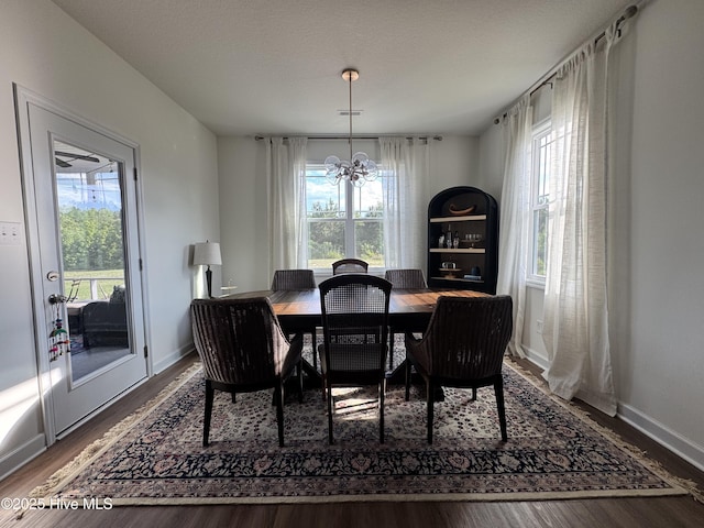 134 Longhorn Rd, Jacksonville, NC 28546 - dining space featuring a chandelier, wood finished floors, and baseboards