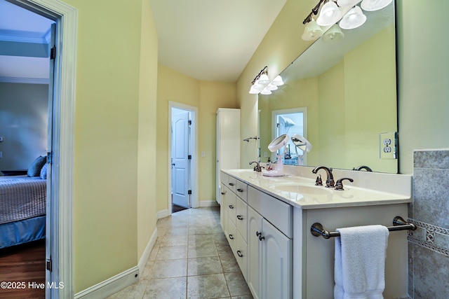 1711 Heather Run Ct SE, Bolivia, NC 28422 - ensuite bathroom with double vanity, baseboards, and tile patterned flooring