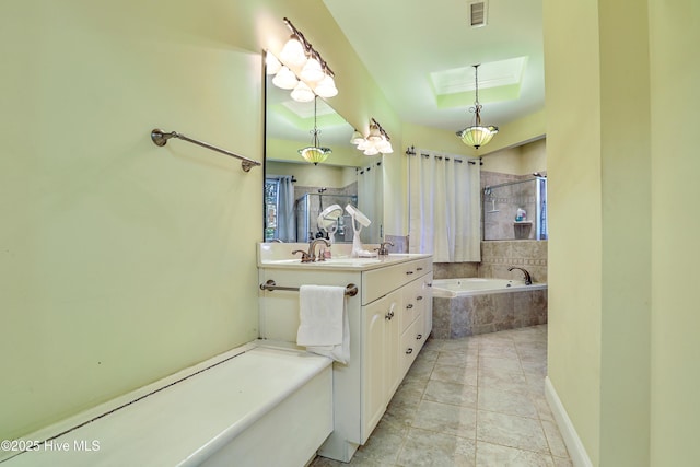 1711 Heather Run Ct SE, Bolivia, NC 28422 - bathroom with tiled bath, vanity, tiled shower, and a raised ceiling