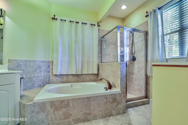 1711 Heather Run Ct SE, Bolivia, NC 28422 - bathroom featuring a bath, a shower stall, plenty of natural light, vanity, and recessed lighting