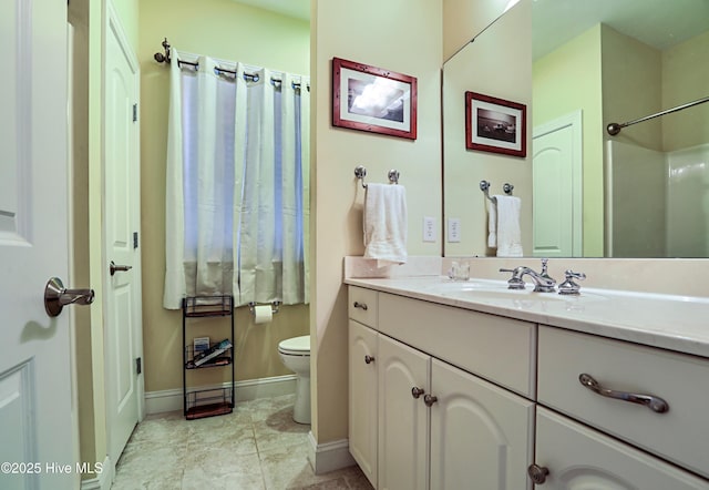 1711 Heather Run Ct SE, Bolivia, NC 28422 - bathroom with vanity, toilet, baseboards, and a shower