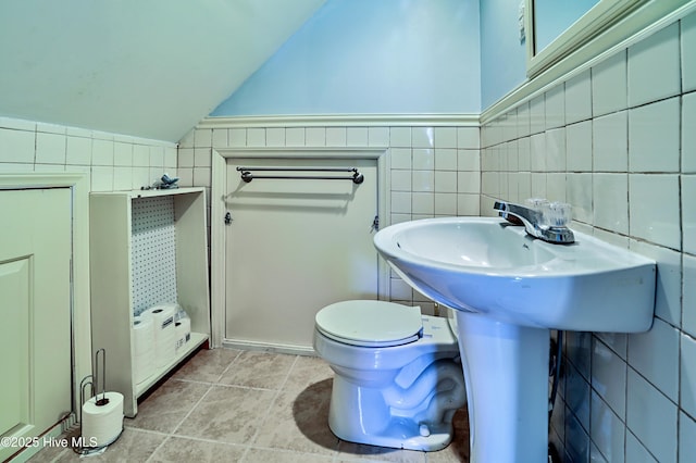 1711 Heather Run Ct SE, Bolivia, NC 28422 - half bathroom featuring tile walls, vaulted ceiling, and toilet