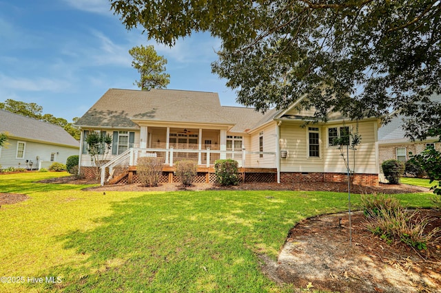 1711 Heather Run Ct SE, Bolivia, NC 28422 - view of front of property with a sunroom, a front lawn, ceiling fan, and a deck