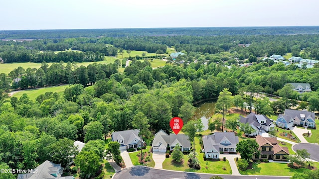 1711 Heather Run Ct SE, Bolivia, NC 28422 - aerial perspective of suburban area with a heavily wooded area