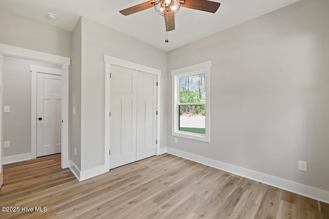 189 Craven Ct, Calabash, NC 28467 - unfurnished bedroom with light wood-type flooring, baseboards, a closet, and ceiling fan