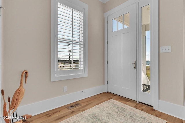 209 S 11th St, Morehead City, NC 28557 - foyer entrance featuring wood finished floors and baseboards