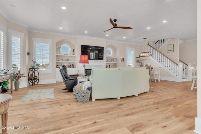 209 S 11th St, Morehead City, NC 28557 - living area featuring crown molding, stairway, ceiling fan, light wood-style floors, and recessed lighting