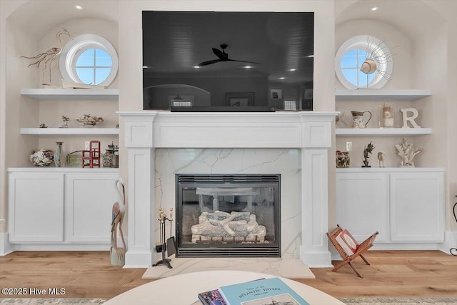 209 S 11th St, Morehead City, NC 28557 - detailed view of wood finished floors, a premium fireplace, and built in features