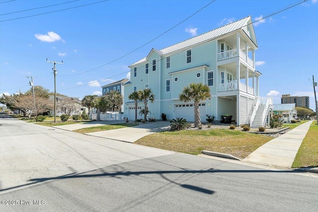 209 S 11th St, Morehead City, NC 28557 - view of property with driveway, a garage, and stairs