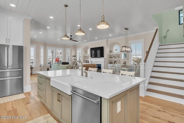 209 S 11th St, Morehead City, NC 28557 - kitchen with stainless steel appliances, a sink, light wood-type flooring, open floor plan, and recessed lighting