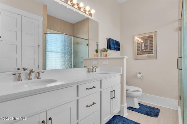 209 S 11th St, Morehead City, NC 28557 - full bath with a stall shower, double vanity, toilet, and baseboards