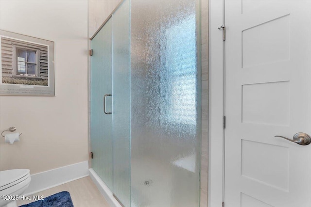 209 S 11th St, Morehead City, NC 28557 - bathroom with a stall shower, baseboards, and toilet