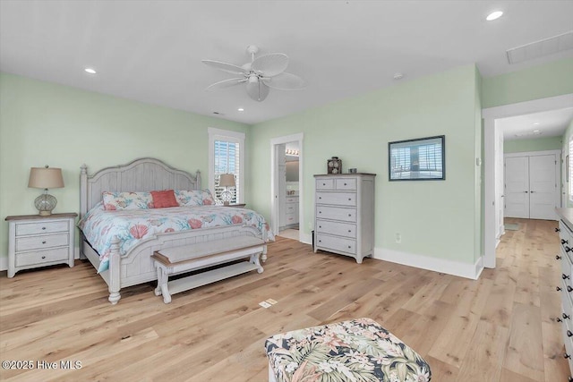 209 S 11th St, Morehead City, NC 28557 - bedroom with light wood-style floors, baseboards, recessed lighting, ceiling fan, and ensuite bathroom