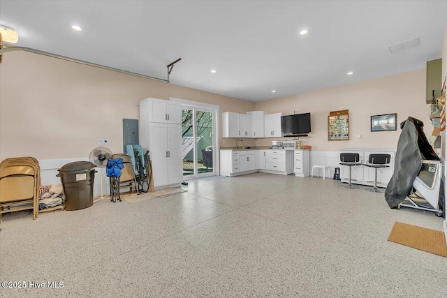 209 S 11th St, Morehead City, NC 28557 - garage featuring electric panel, recessed lighting, and a sink