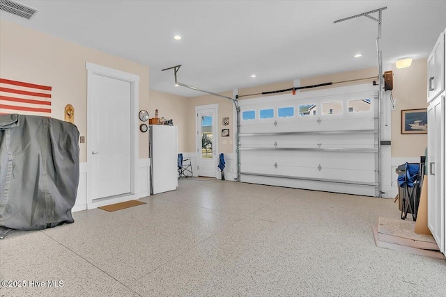 209 S 11th St, Morehead City, NC 28557 - garage featuring recessed lighting and refrigerator