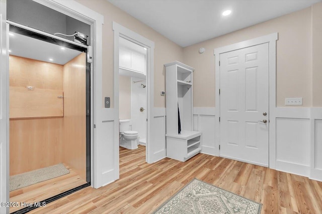 209 S 11th St, Morehead City, NC 28557 - foyer entrance with light wood-type flooring, wainscoting, and recessed lighting
